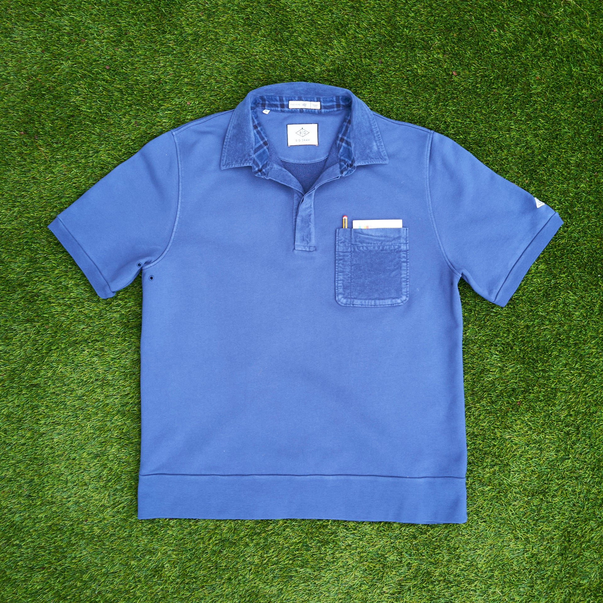 The Fife golf polo in wavey blue. flat lie front
